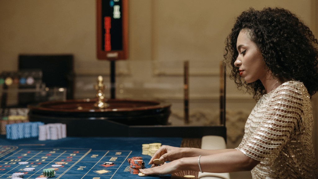 A person playing roulette in a casino