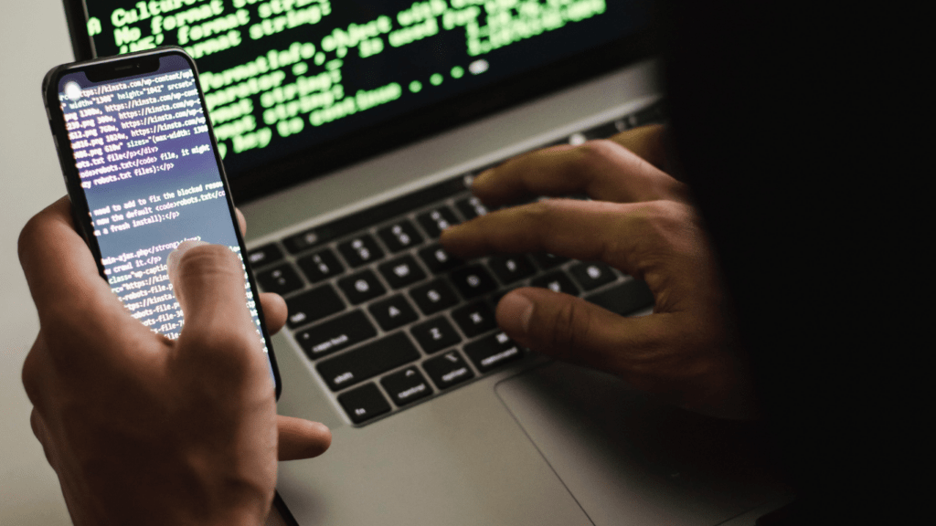 a person typing a code in a computer