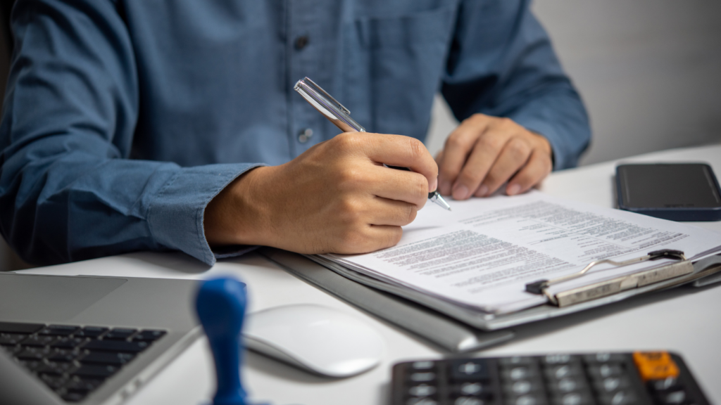 a person holding a pen