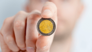 a person holding a coins