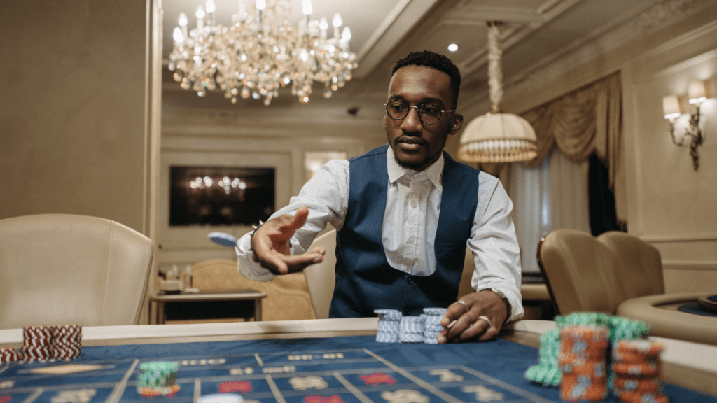 A person playing roulette in a casino