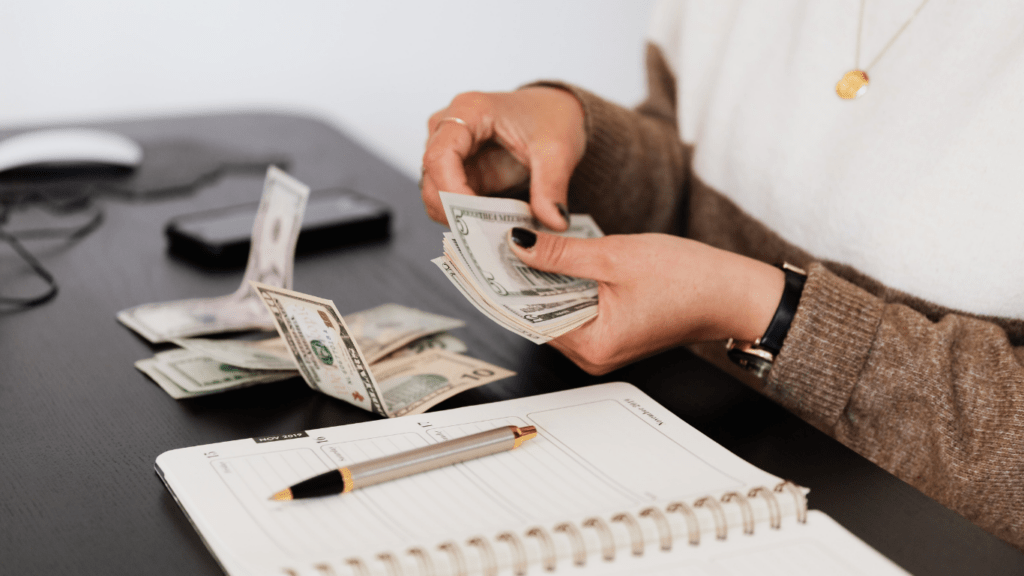 image of a person counting money