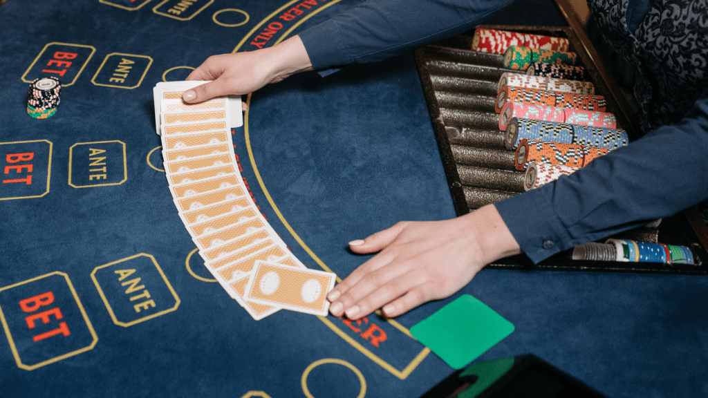 a person playing blackjack at a casino table