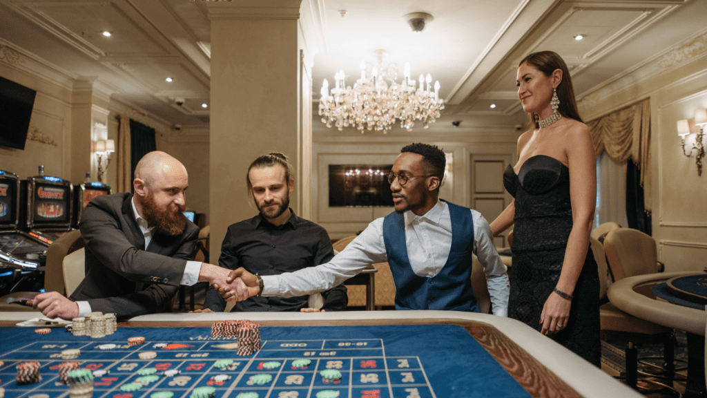 a group of people playing roulette in a casino