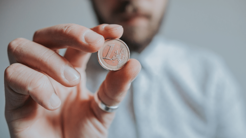 a person holding a crypto coin