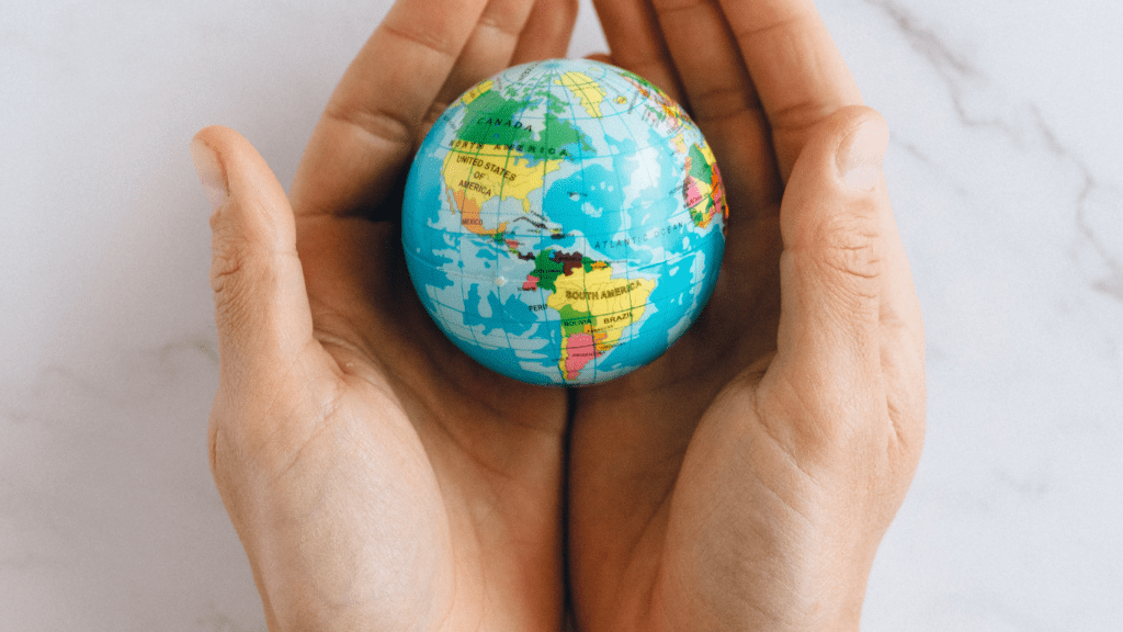 a person holding a globe