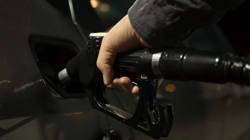 a person is filling up their car with gas